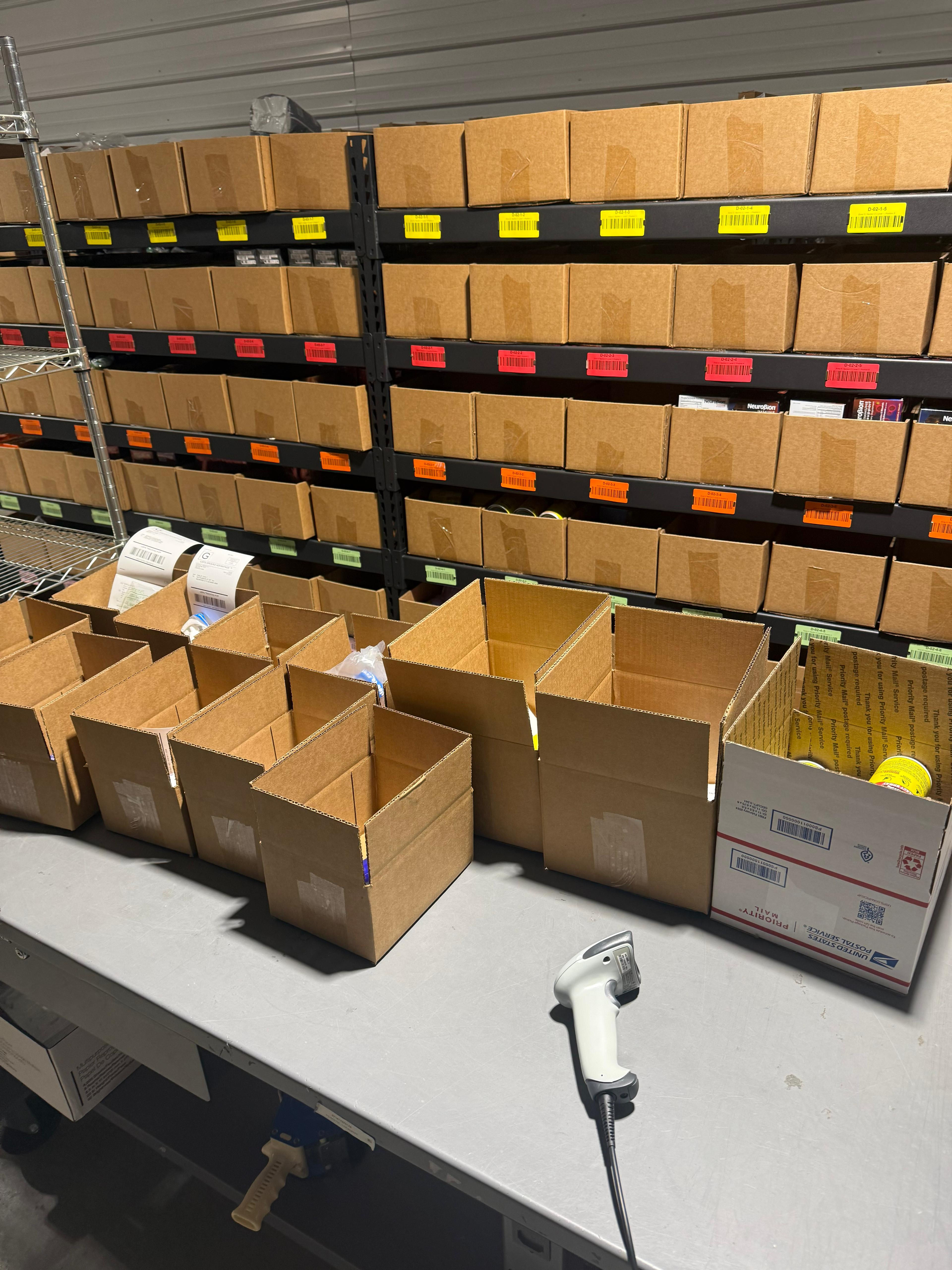 Inside 365PrepCenter warehouse — shelves of inventory ready for FBA